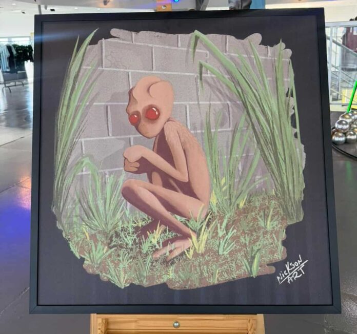 quadro-et-de-varginha-Nickson-Ferreira Quadro ET de Varginha pintado pleo varginhense Nickson Ferreira mostra o ET de Varginha em sua famosa pose, agachado, da fforma como foi visto