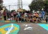 Instituto Amanda Ribas reúne 80 crianças em pintura de rua para Copa do Mundo em Varginha